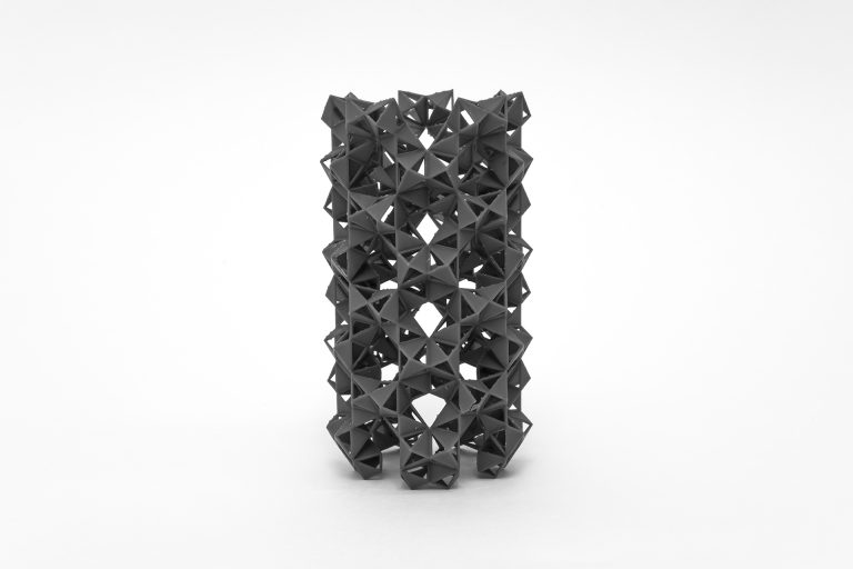 A three-dimensional structure composed of interlocking black rings.
