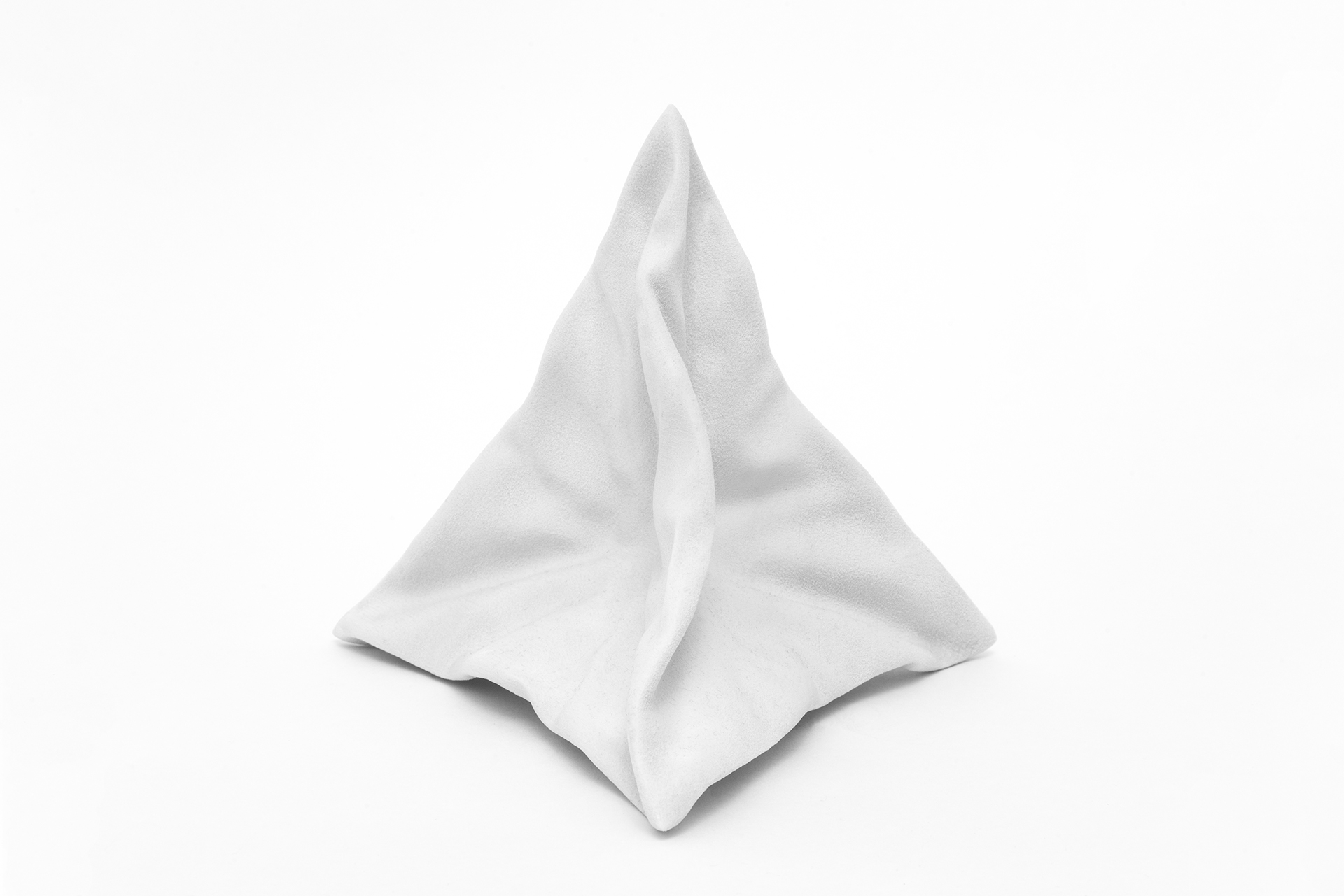 Gray sculpture on white background depicting the top half of a human torso.