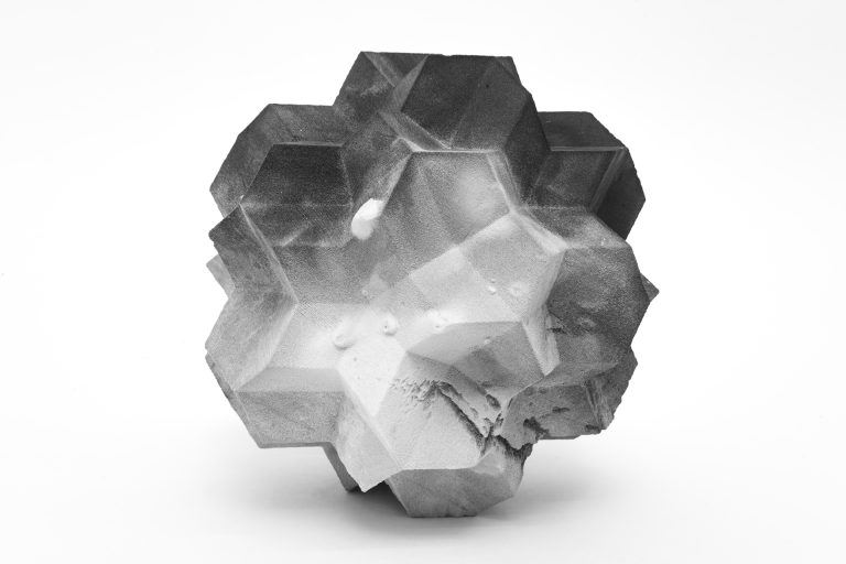 This image shows a 3D printed resin sculpture shaped like a crystal cluster.