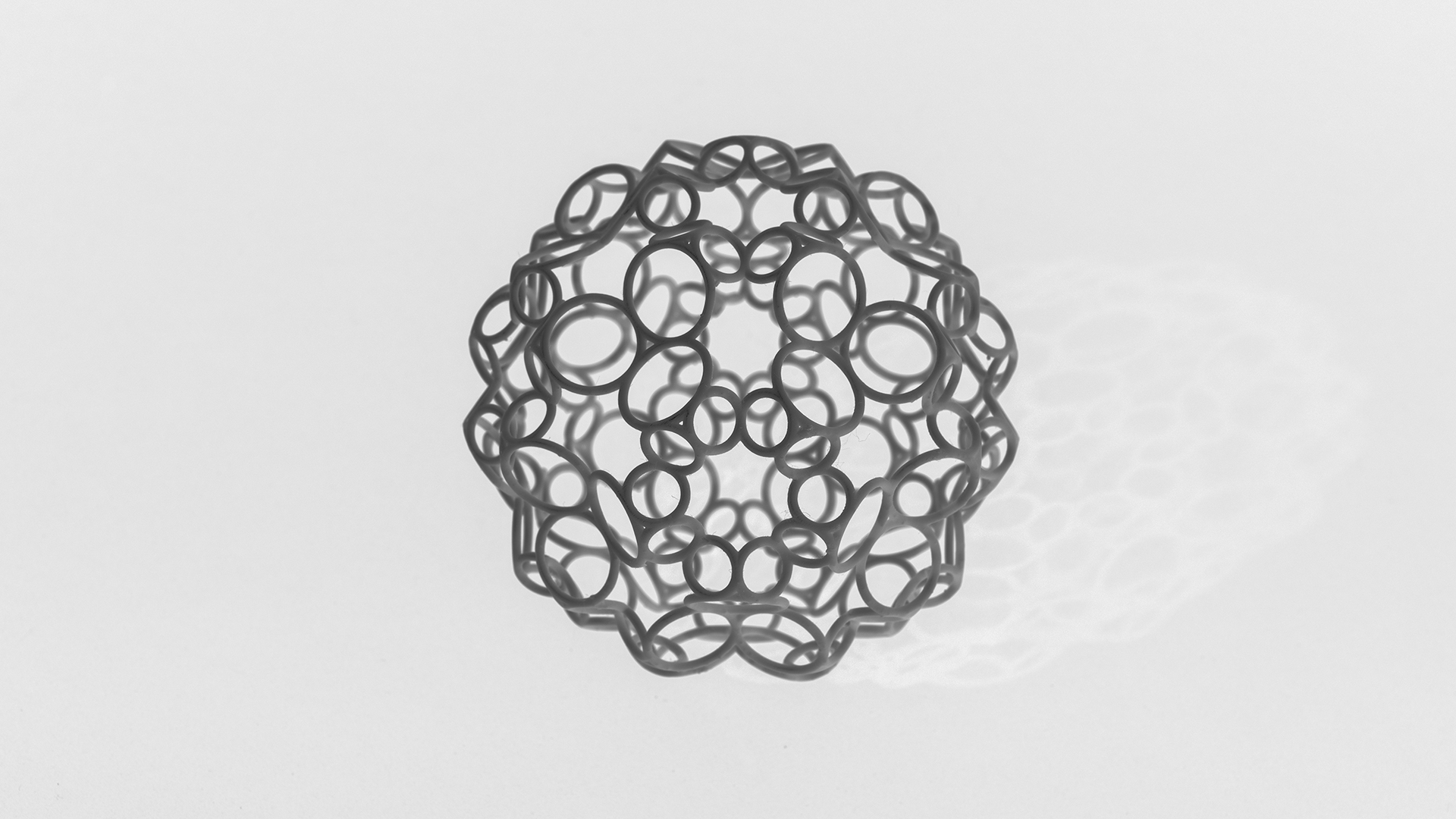 Glass sculpture with interlocking rings.