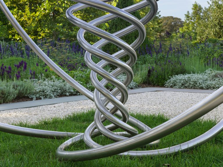 Sculpture made of curved metal rods.