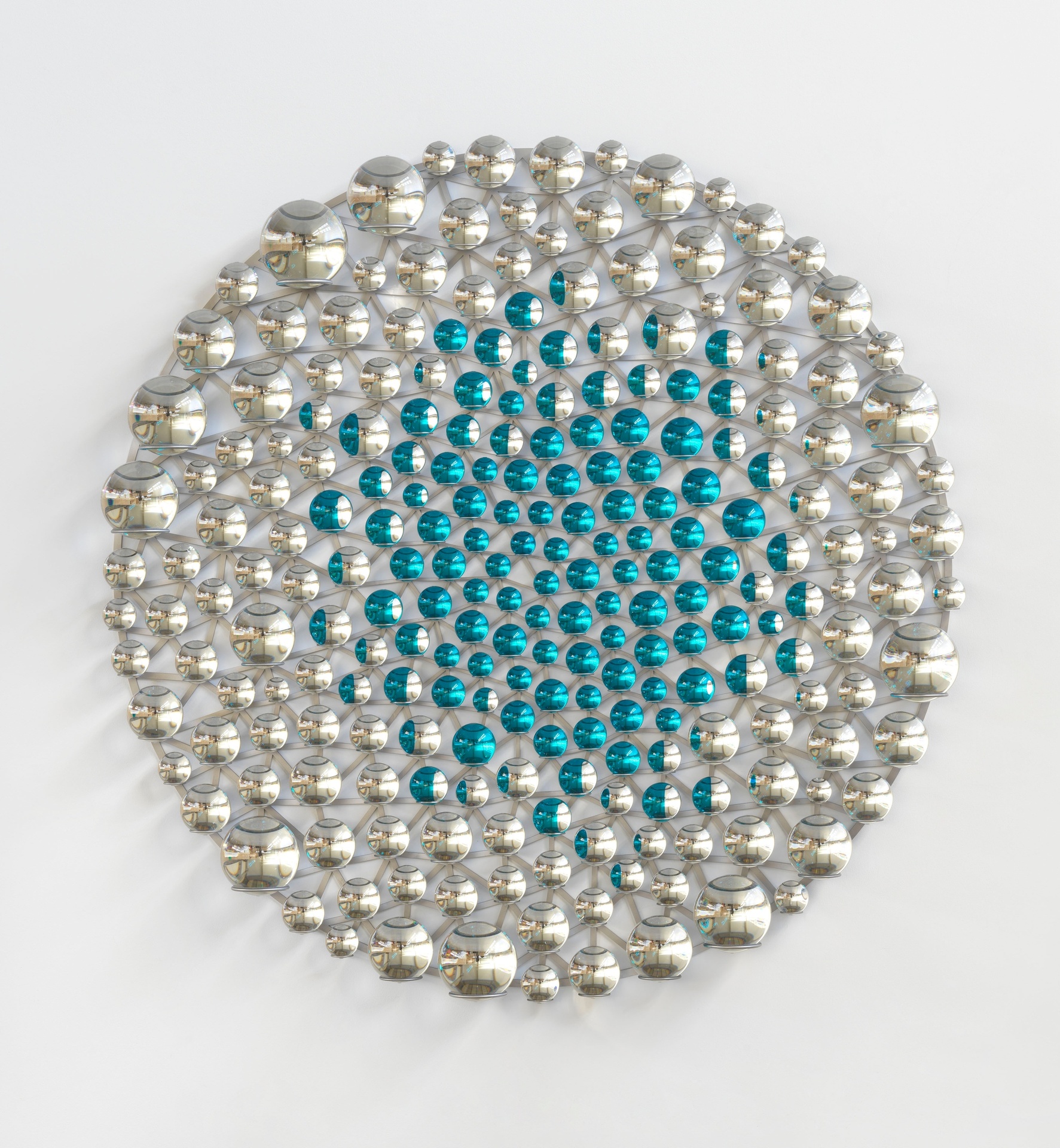 The artwork is a circular arrangement of glass spheres with cyan centers and silvered metal accents.