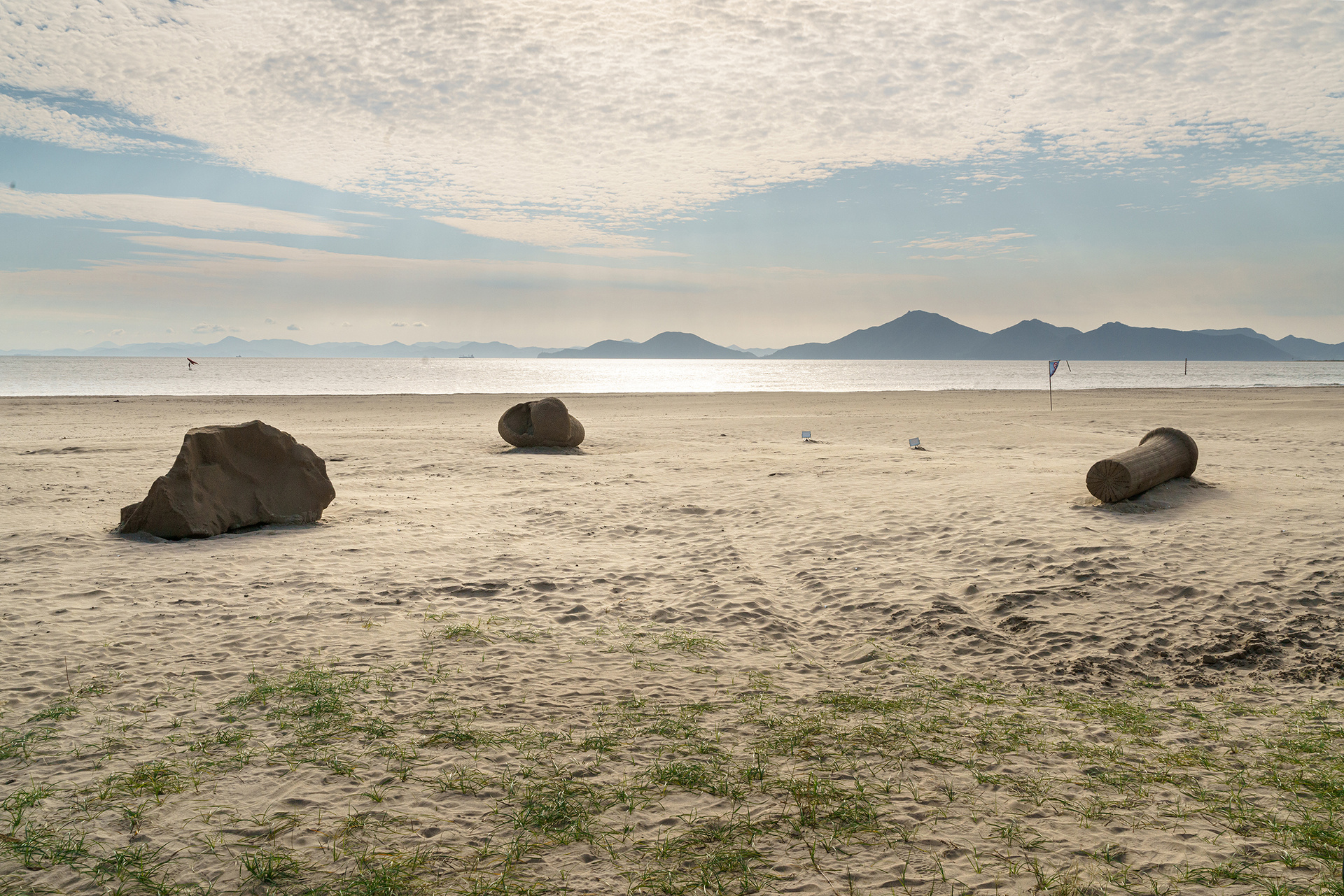 A row of stones on the beach.
