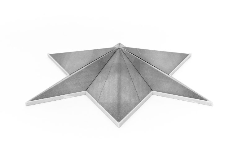 Five-Fold Puzzle ET is a 3D-printed resin sculpture showcasing five-fold symmetry.