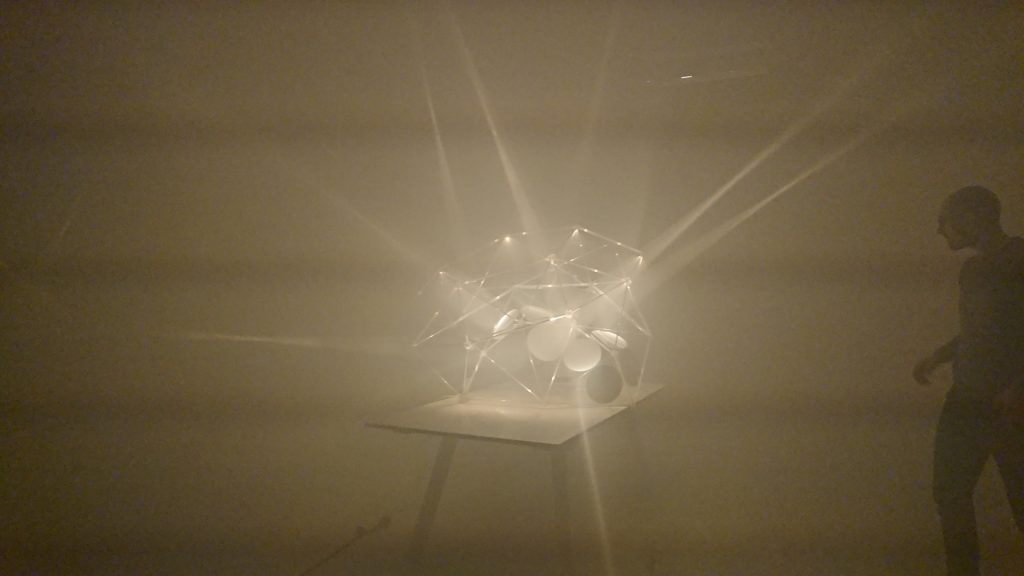 Parabol Stars sculpture made of 3D printed resin is displayed in a dimly lit room.