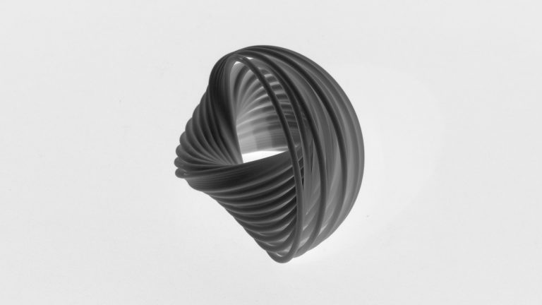 3D printed resin model of Hopf Fibrations is suspended against white background.