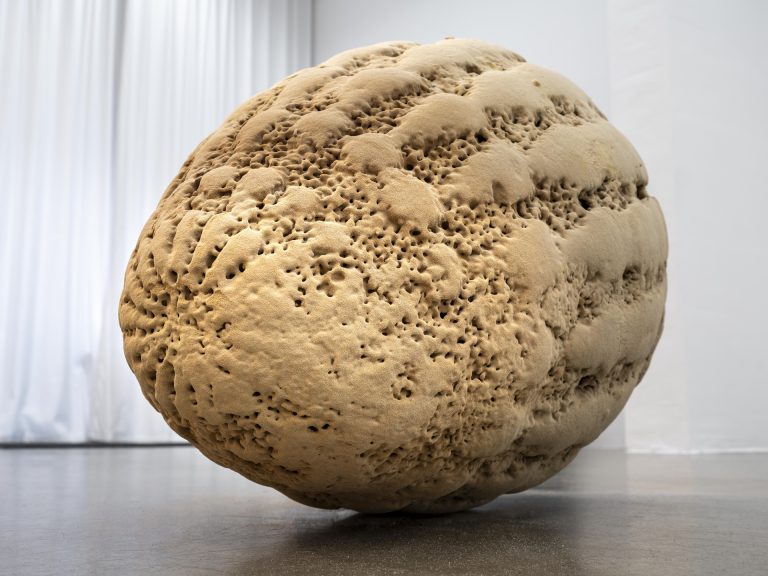 Sculpture made with 3D printed sand sits on gallery floor.