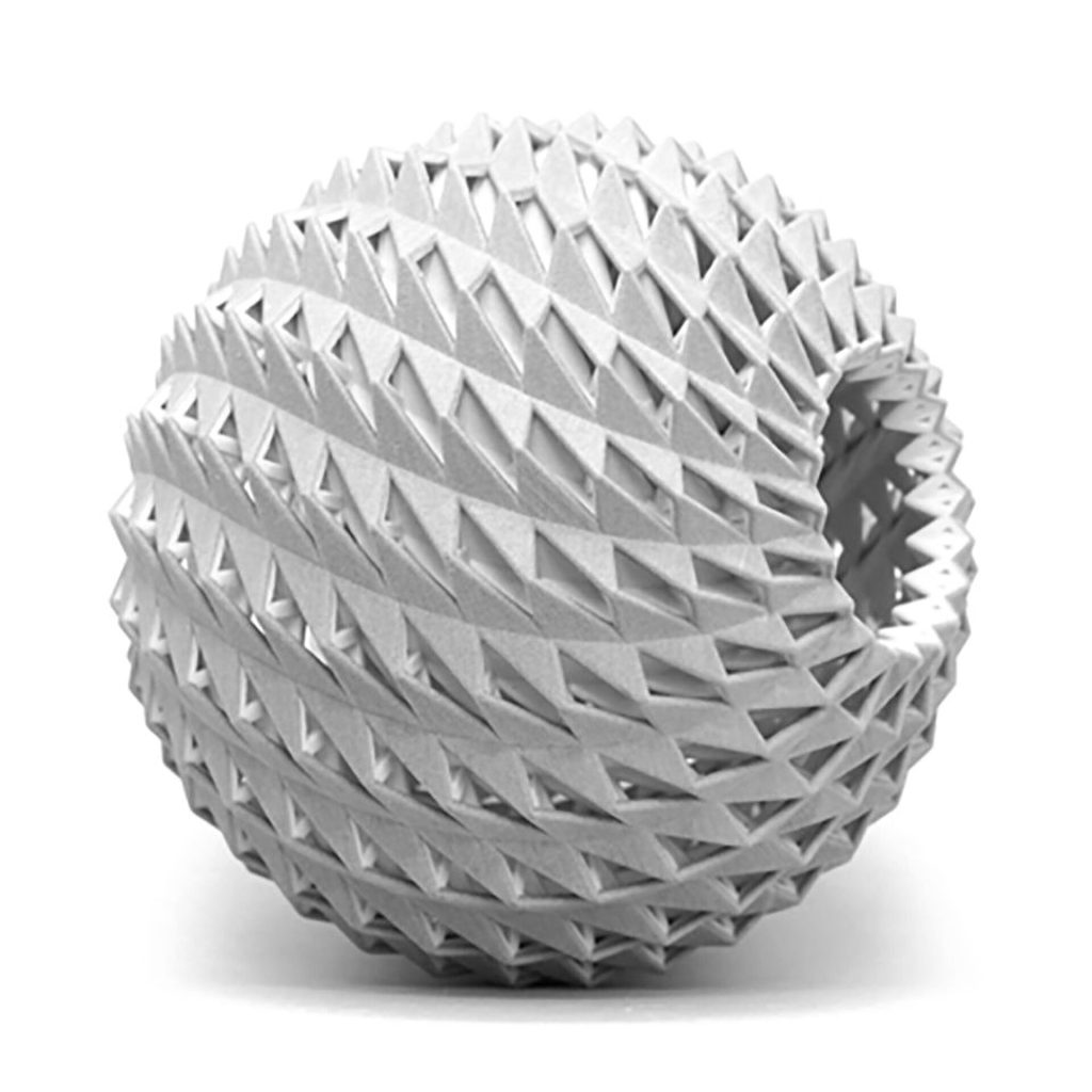 Atm Sphere (2019) by Phillip C. Reiner is a 3D printed resin model. It uses triangular panels to reflect light twice from a central source, creating a glowing shell without direct visibility of the light.