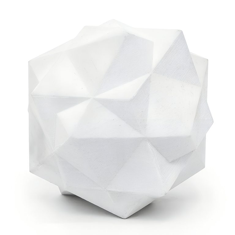 A white 3d printed resin geometric compound sits on a white surface.