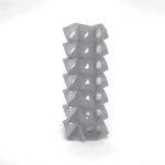 A 3D-printed resin tower stacks interlocking SuperCube rings with tetrahedral indentations.
