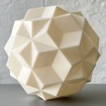 A 3D printed resin polyhedron sits on a gray surface.