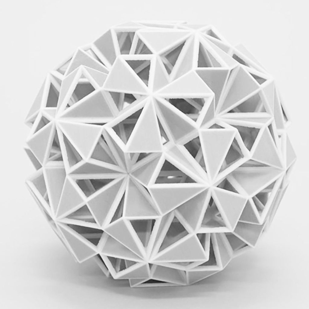 A white 3D printed resin sphere is built from interlocking triangular modules.