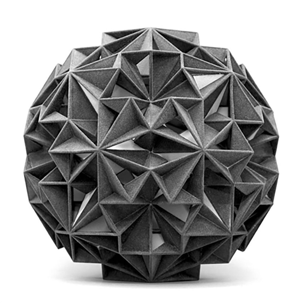 A 3D printed resin sphere has interlocking triangular facets and open geometric gaps.