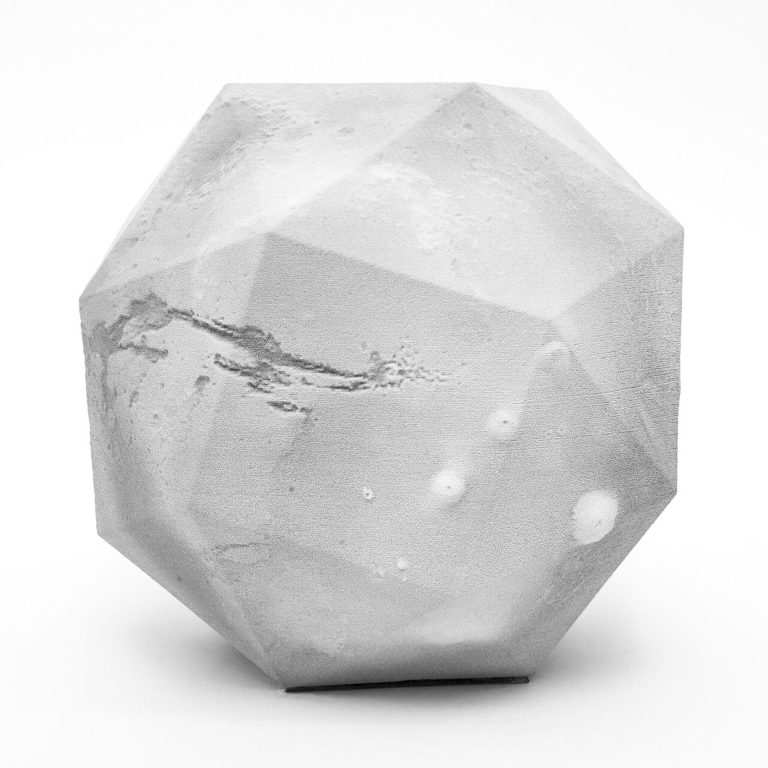 A 3D printed resin polyhedron displays Mars surface topography on its facets.