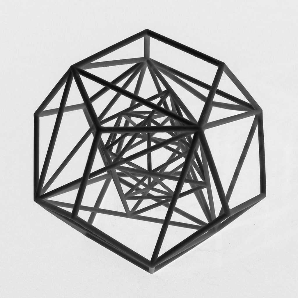 Black 3D printed resin polyhedra share a center in a compound.