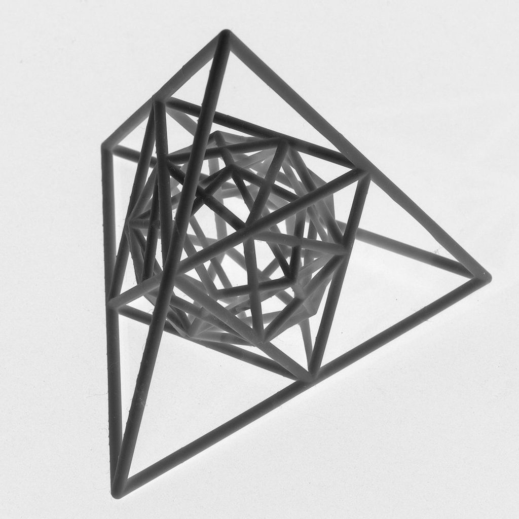 A 3D printed resin model shows interlaced regular polyhedra sharing a common center.